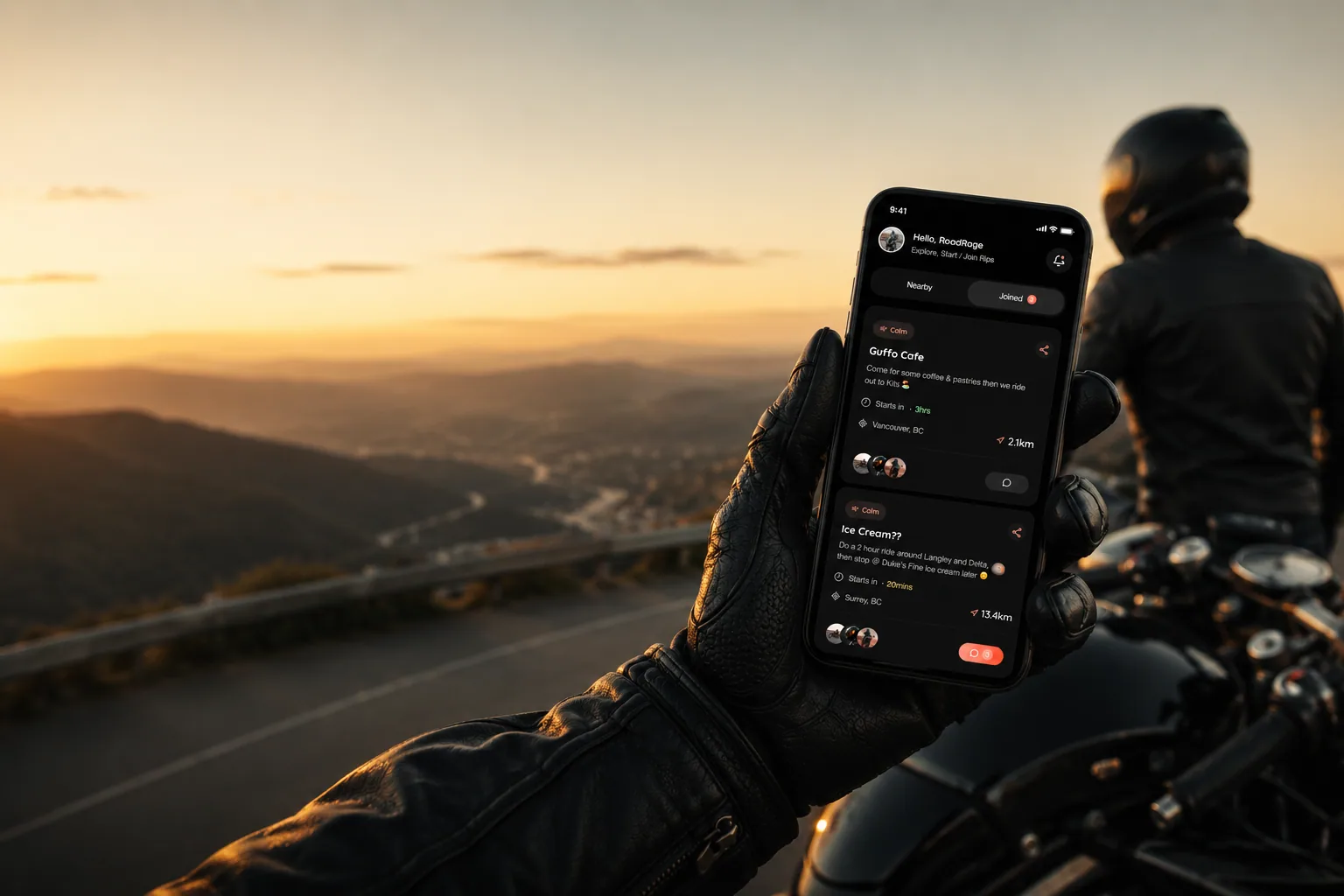 A rider at a hilltop viewpoint at sunset holding a phone showing the Tribes app with a list of upcoming group rides