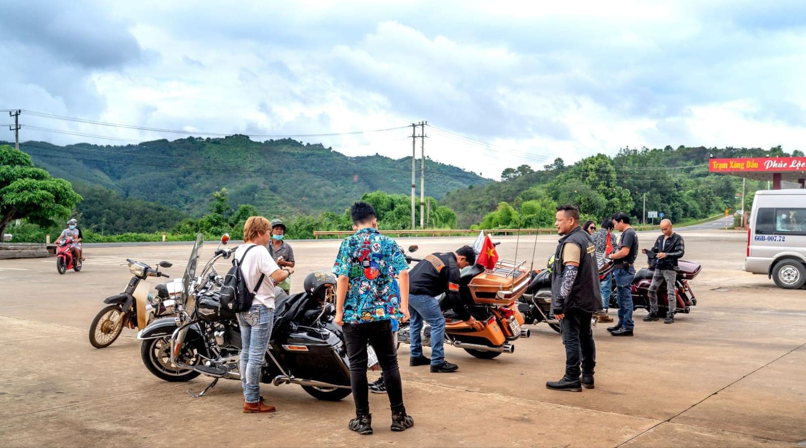A group of motorcyclists riding together on an open road
